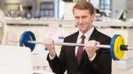 Office worker lifting weights