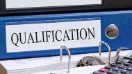 Binder with 'qualification' written on it