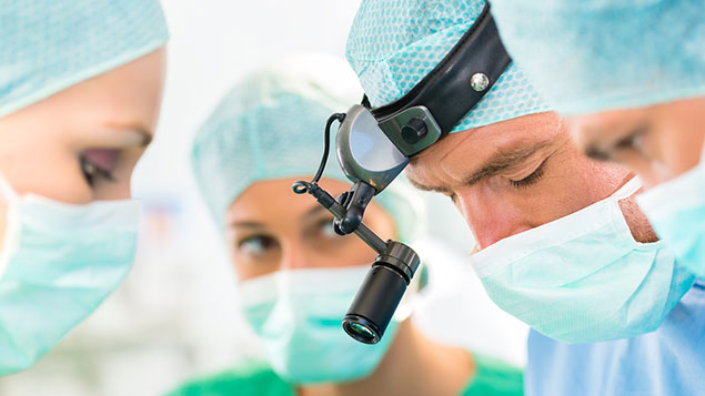 Close up of doctors and nurses in surgery