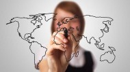 Woman drawing world map