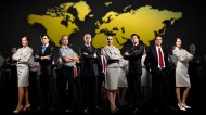 World map behind business people