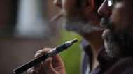 Vaping e-cigarettes in the workplace is not the same as smoking. Photo: Sarah Alcalay/SIPA/REX