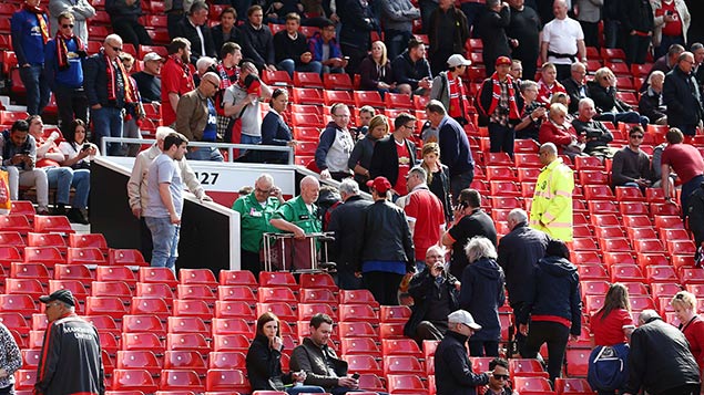 Man Utd fans evacuate Old Trafford last weekend. Photo: Matt West/BPI/REX/Shutterstock