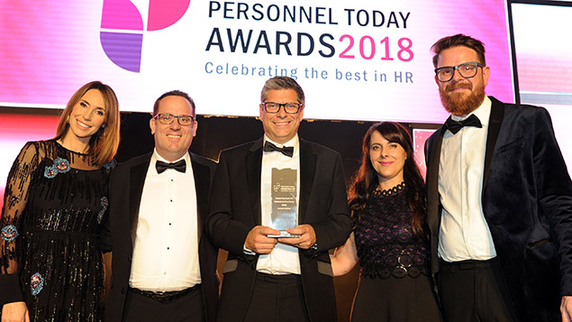 Members of the Evershed Sutherland team receive their Employment Law Firm of the Year award from the One Show's Alex Jones and Rob Moss, editor of Personnel Today.