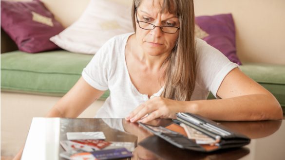 A woman looking concerned about money