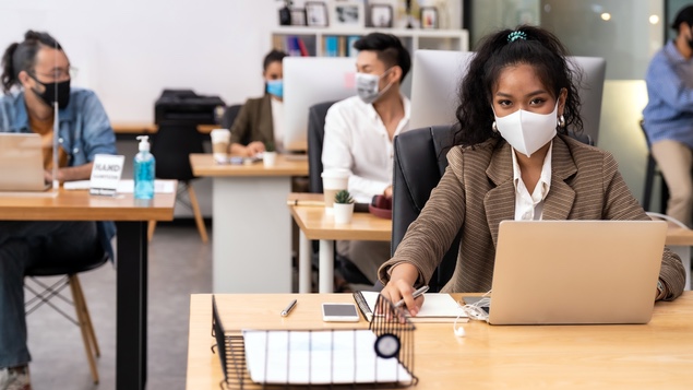 workers in office with masks