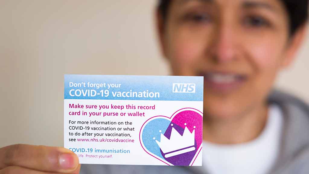 Covid-19 vaccination card. Paul Maguire / Shutterstock