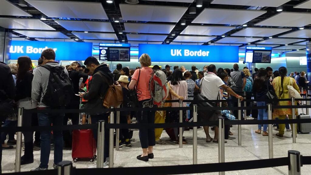 People queue at UK airport