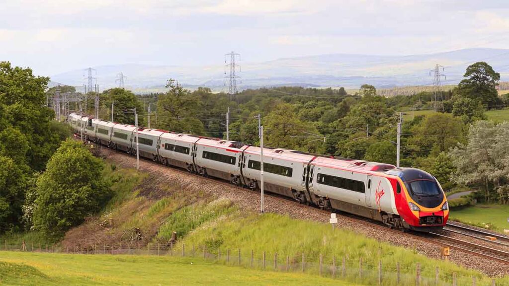 A Virgin Train travelling through the countryside
