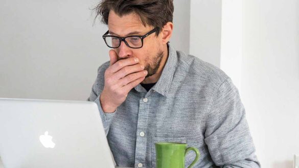 Man works from home while unwell - take part in our absence and hybrid working survey
