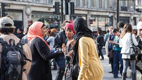 A group of women wearing headscarves on London's Oxford Street