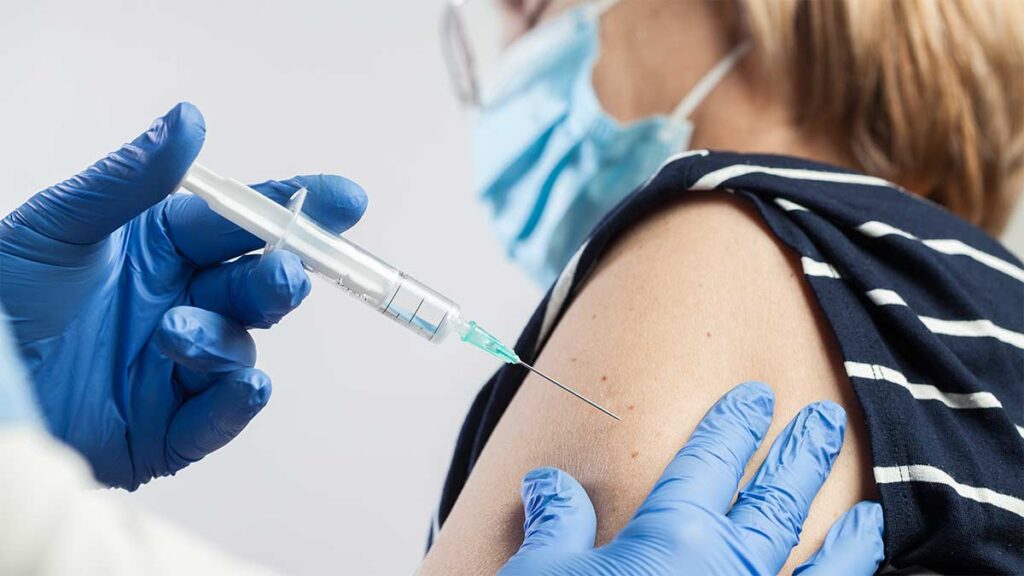 A woman having a Covid-19 jab