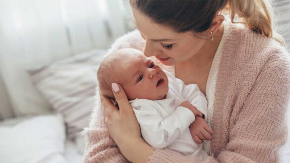 Statutory maternity pay 2023 rate. A mother with a newborn baby