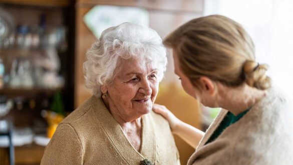 Woman caring for elderly relative
