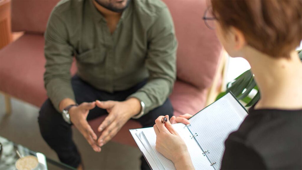 Therapist with a male patient