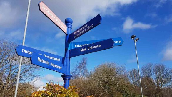 NHS workforce plan: Hospital sign showing different departments