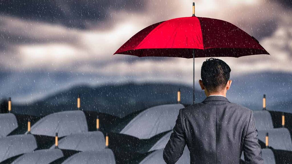 Umbrella companies call for evidence response: picture of back of a businessman with a red umbrella