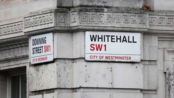 Government buildings sewage: A Whitehall road sign on the side of a government building