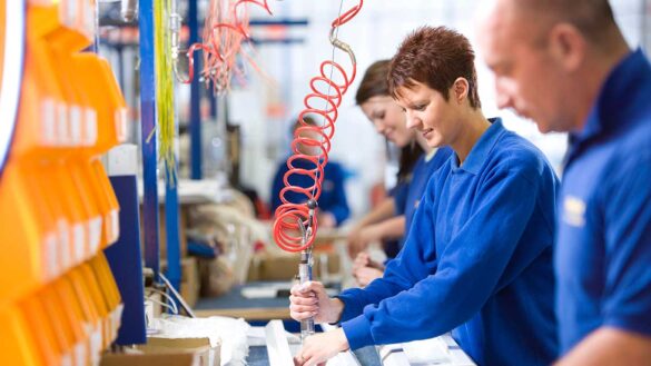 Manufacturing hiring: a group of employees working in a factory