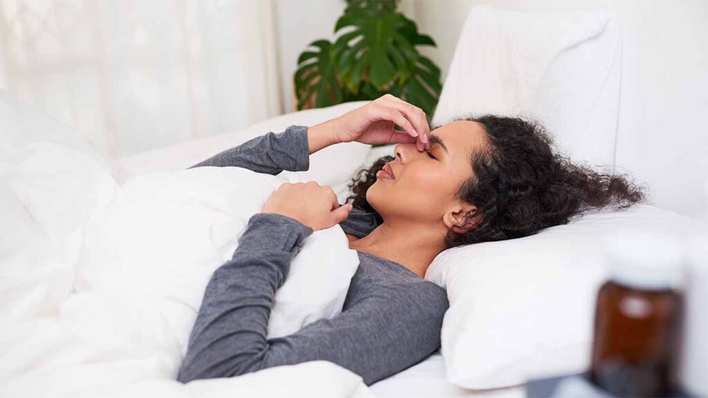A woman in bed with long Covid