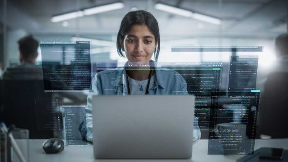 AI in employment: A young woman sitting at a laptop