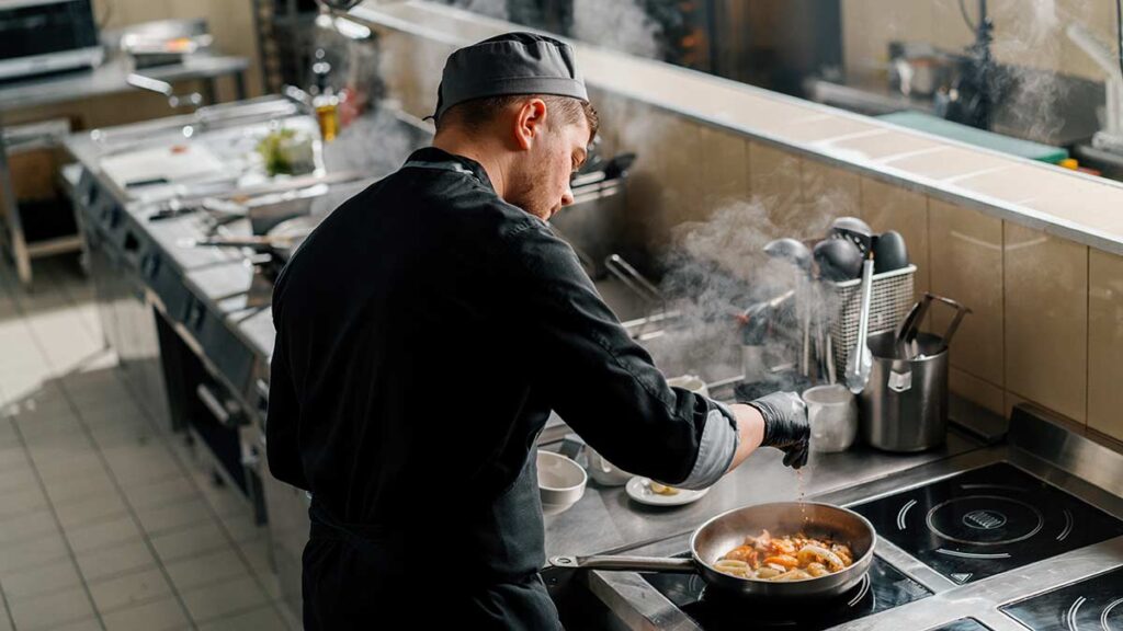 A man working in a professional kitchen