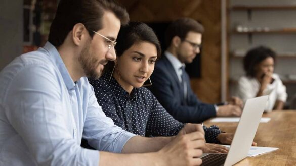 PwC topped the Social Mobility Employers Index for the third time. Picture shows a group of interns at work.