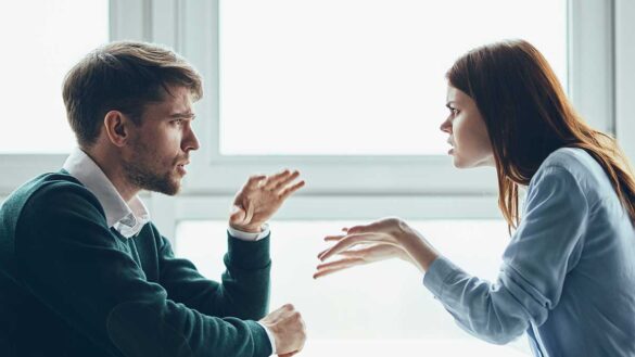 A man and a woman having an argument at work