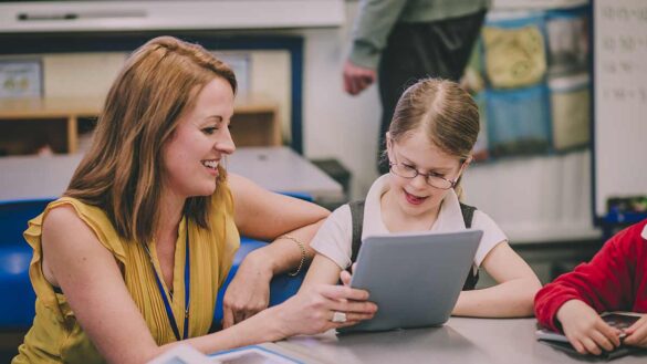 A teaching assistant in a school
