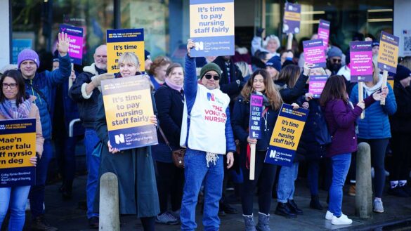 Nurses, members of the RCN, on strike in 2022. They are holding placards outside a hospital.