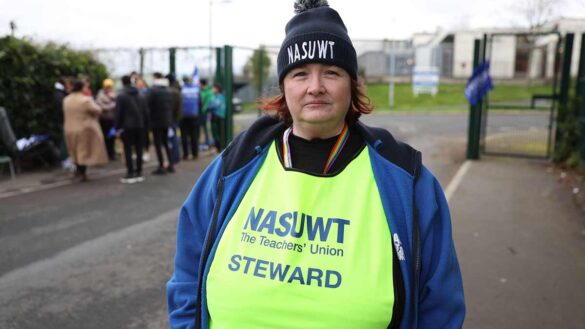 Who is on strike and when? A teacher on a picket line in Northern Ireland.