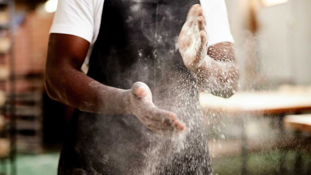 A baker with dusty hands