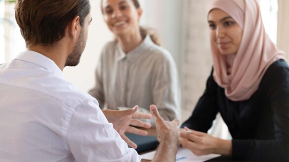 Religion at work: Muslim employee in a meeting