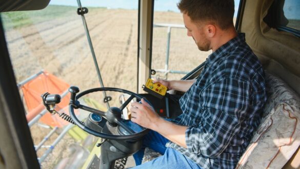 young man driving tractor