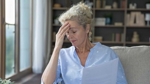 Gender pension gap 2024: a worried woman at home