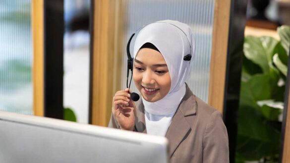 Call centre employee speaking into a headset