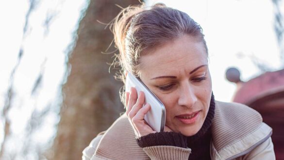 A woman on the phone outside