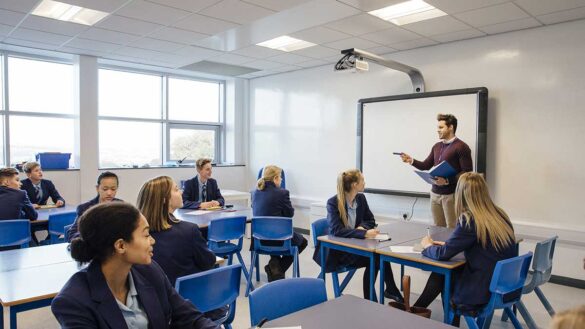 A secondary school teacher in a classroom of pupils