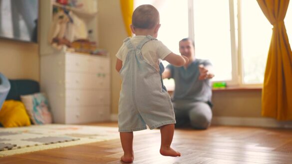 A baby taking his first steps