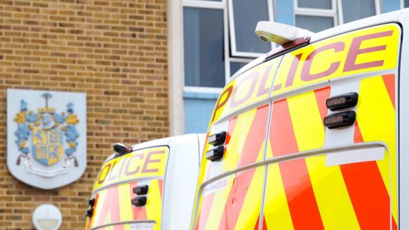 Police vans outside a police station in Dorset