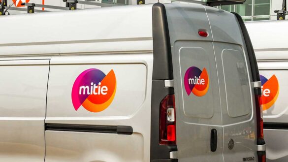 A Mitie logo on a silver van