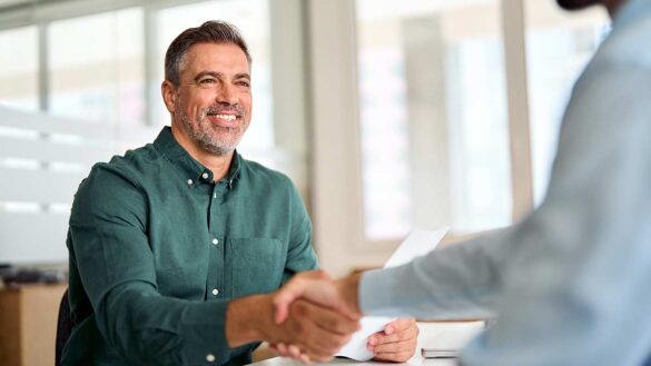 A man shaking somebody's hand