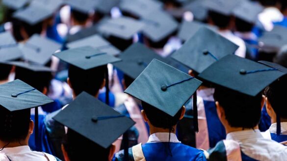 A rear-view of graduates at a graduation ceremony