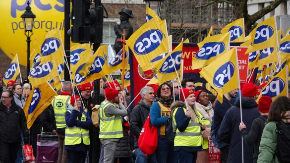 PCS members holding flags during a march
