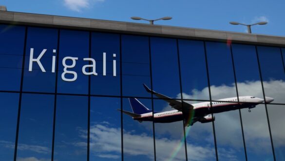 Terminal building and reflection of aircraft arriving at Kigali airport
