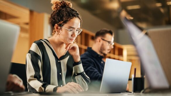 Younger woman using laptop