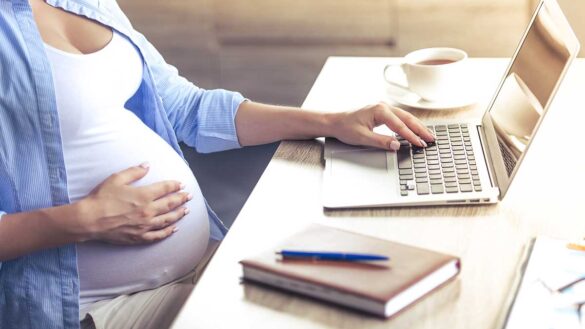Pregnant woman at a desk