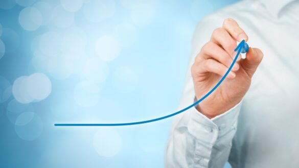 Public sector productivity - Cebr research. Photo shows a person drawing an upward graph.