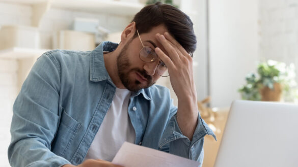Man looks fed up in office