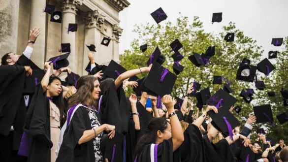 Young people less work ready. Photo show new graduates throwing hats in the air.